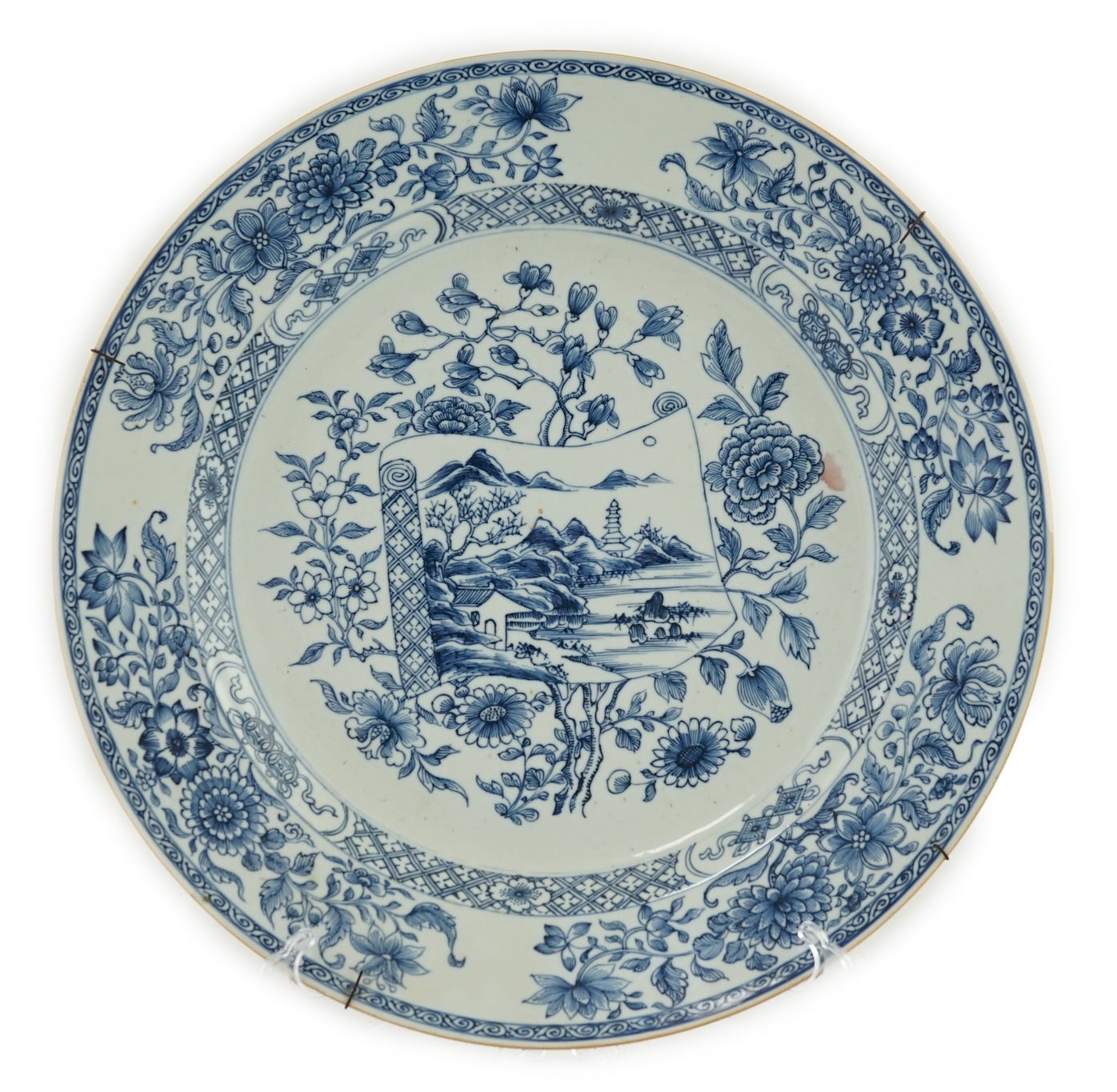 A Chinese blue and white 'scroll and blossom' charger, Qianlong period